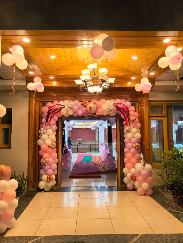 Balloon archway entrance lit up at night